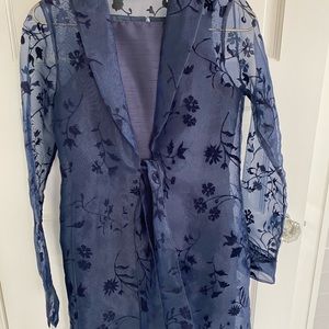 Sleeveless sheath dress and sheer topper